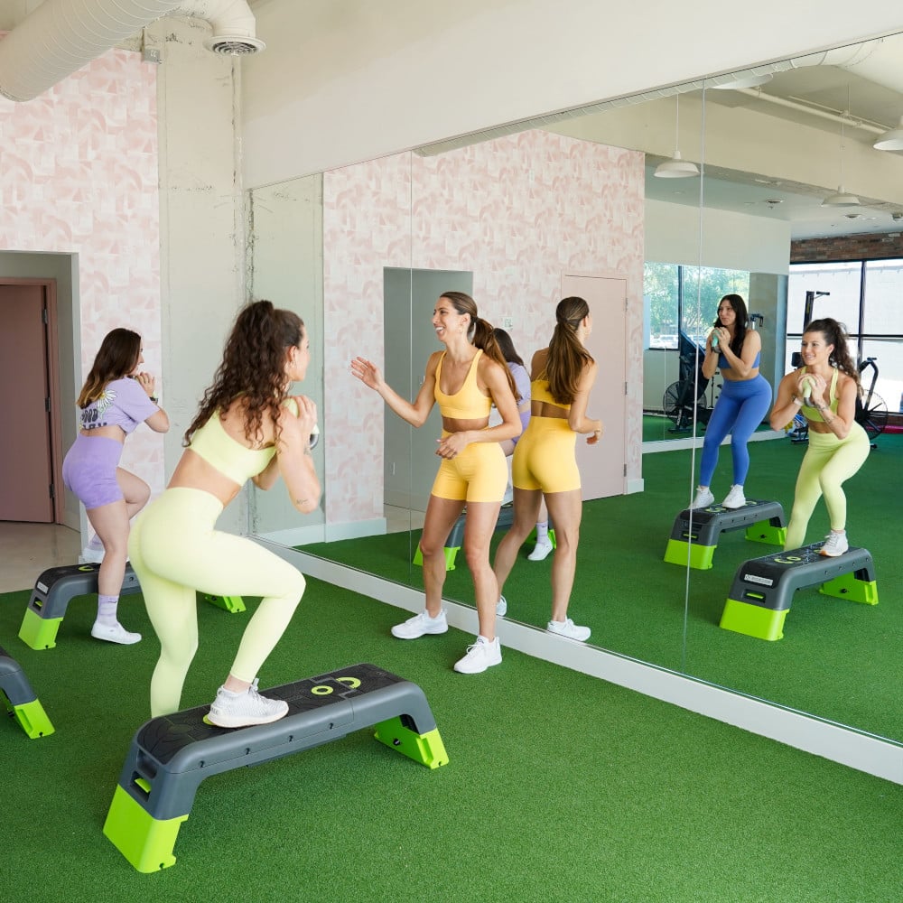 Nicole Nahed teaching a group fitness class for women of all ages